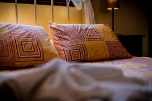 two pillows sitting on top of a bed at Villa Evelyn in Stafylos