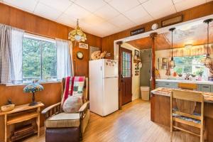 a kitchen with a white refrigerator in a room at Historical Cabin in Julian Pet's okay! in Julian