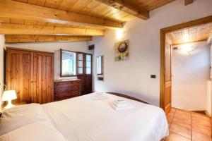 Posteľ alebo postele v izbe v ubytovaní Incanto Walser Apartments Ronco
