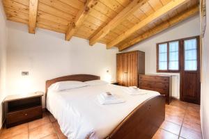 Posteľ alebo postele v izbe v ubytovaní Incanto Walser Apartments Ronco