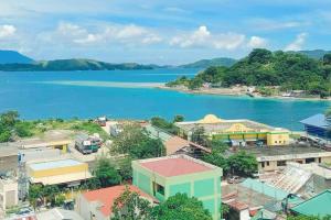 een luchtzicht op een stad naast een waterlichaam bij Shared Room/ Dormitory Bed in Romblon Romblon in Romblon