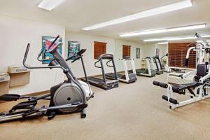 a gym with several exercise bikes and tread machines at Sonesta Simply Suites Knoxville in Knoxville