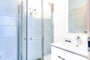 a bathroom with a shower and a sink at Luxury Sea Side 3BR by Airsuite in Ashdod