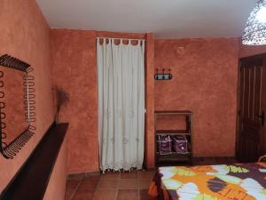 A bed or beds in a room at Casa Rural La Torreta en El Rincón de Ademuz