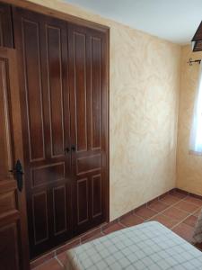 A bed or beds in a room at Casa Rural La Torreta en El Rincón de Ademuz