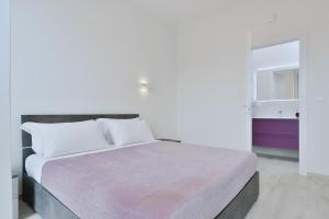 Ein Bett oder Betten in einem Zimmer der Unterkunft Milleventi Apartments Bologna