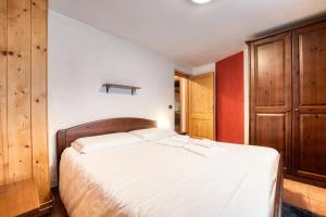 Posteľ alebo postele v izbe v ubytovaní Incanto Walser Apartments Ronco