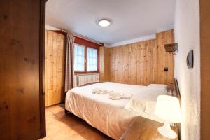 Posteľ alebo postele v izbe v ubytovaní Incanto Walser Apartments Ronco