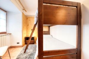 Posteľ alebo postele v izbe v ubytovaní Incanto Walser Apartments Ronco