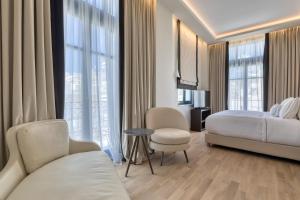 Posteľ alebo postele v izbe v ubytovaní Grand Hotel Kalamata