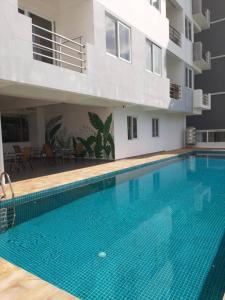 a large swimming pool in the middle of a building at Seaview Modern Studio in Sihanoukville