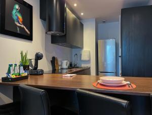 a kitchen with a table with a bowl on it at Elegant and comfortable apartment Warsaw in Warsaw