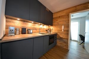 Kuchyň nebo kuchyňský kout v ubytování Ferienwohnung STRAND PIET