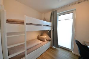 Postel nebo postele na pokoji v ubytování Ferienwohnung STRAND PIET