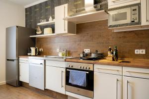 Η κουζίνα ή μικρή κουζίνα στο Ferienwohnung für 4, mitten in Solingen