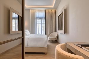 Posteľ alebo postele v izbe v ubytovaní Grand Hotel Kalamata