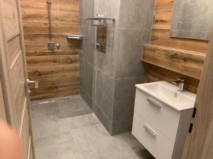 Koupelna v ubytování Apartmány na Plešivci