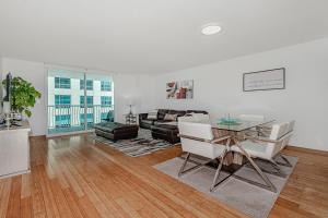 a living room with a couch and a table at Miami condo with city & ocean views! Sleep up to 6! in Miami