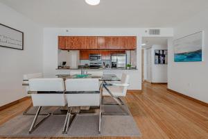 a kitchen and living room with a table and chairs at Miami condo with city & ocean views! Sleep up to 6! in Miami