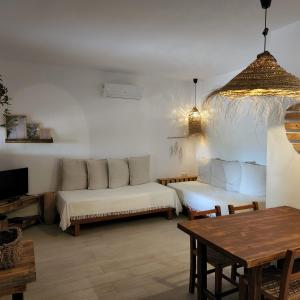 a living room with a couch and a table at Appartamentos Michel Dos in Sant Ferran de Ses Roques