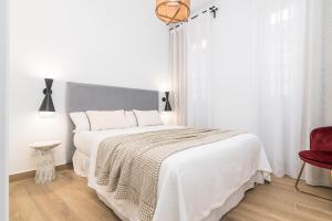 Posteľ alebo postele v izbe v ubytovaní iloftmalaga Santa María