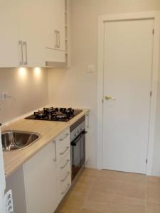 A kitchen or kitchenette at Enjoy your holidays 300m to the Mediterranean sea at Villa DIVALI