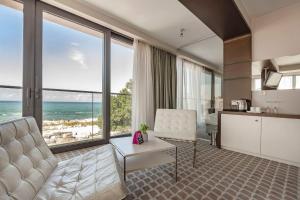 a living room with a view of the ocean at VacationClub – Marine Hotel Apartament 320 in Kołobrzeg
