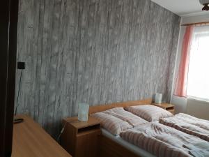 Uma cama ou camas num quarto em Hotel Alf