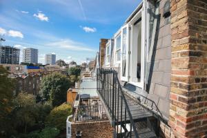 a balcony of a building with a view of a city at Magnificent Maida Vale 1bd apt for 3 in London