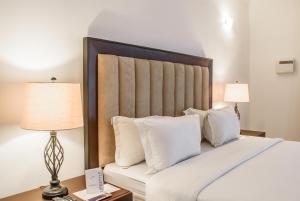Letto o letti in una camera di Pier Harbour Residences and Spa