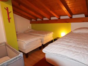 a room with three beds in a room at Chalet Samoëns, 5 pièces, 14 personnes - FR-1-624-7 in Samoëns