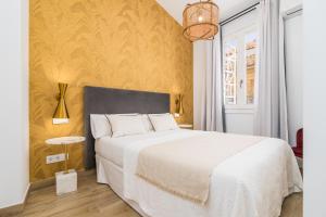 Postel nebo postele na pokoji v ubytování iloftmalaga Santa María