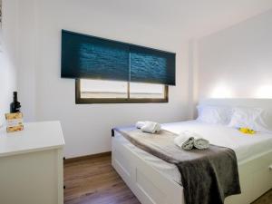 Postel nebo postele na pokoji v ubytování 1d Tamaimo Apartment