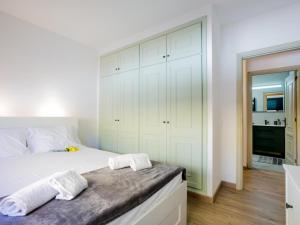 Postel nebo postele na pokoji v ubytování 1d Tamaimo Apartment