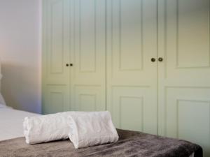 Postel nebo postele na pokoji v ubytování 1d Tamaimo Apartment