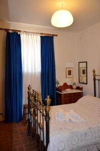 Posteľ alebo postele v izbe v ubytovaní Olive Cottage