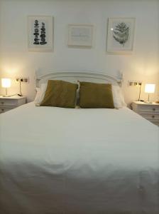 A bed or beds in a room at Balcón del Cardenal