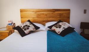 Postel nebo postele na pokoji v ubytování Famy Hostal Nardo's