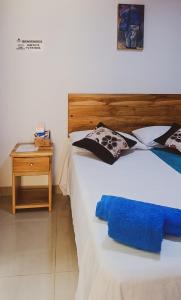 Postel nebo postele na pokoji v ubytování Famy Hostal Nardo's