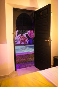 Postel nebo postele na pokoji v ubytování Majorel Pearl Hotel-Riad-Restaurant Piscine&Spa