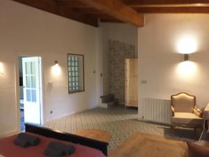 a living room with a couch and a chair at Getxo Garden Houses - The Suite in Getxo