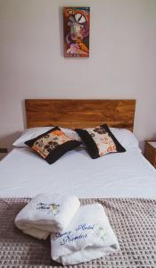 Postel nebo postele na pokoji v ubytování Famy Hostal Nardo's
