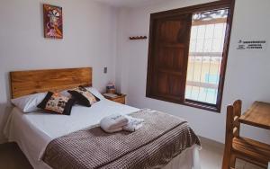 Postel nebo postele na pokoji v ubytování Famy Hostal Nardo's