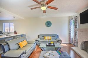 a living room with two couches and a fireplace at Modern Sacramento Home with Yard 12 Mi to Dtwn in Rancho Cordova