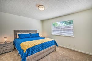 a bedroom with a bed and a window at Modern Sacramento Home with Yard 12 Mi to Dtwn in Rancho Cordova