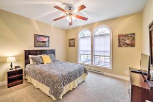 a bedroom with a bed and a ceiling fan at Scenic Views! Ski-In/Ski-Out Condo in Beech Mtn in Beech Mountain