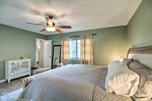 a bedroom with a bed and a ceiling fan at Updated Albuquerque Home with Backyard and Grill! in Albuquerque