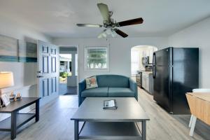 a living room with a couch and a ceiling fan at Silver Sands in St Pete Beach