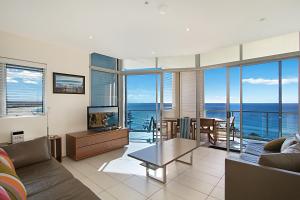 a living room with a view of the ocean at Blue C Coolangatta in Gold Coast
