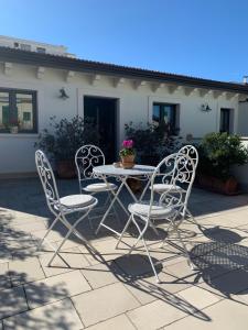 a table and four chairs on a patio at Stella in Terlizzi